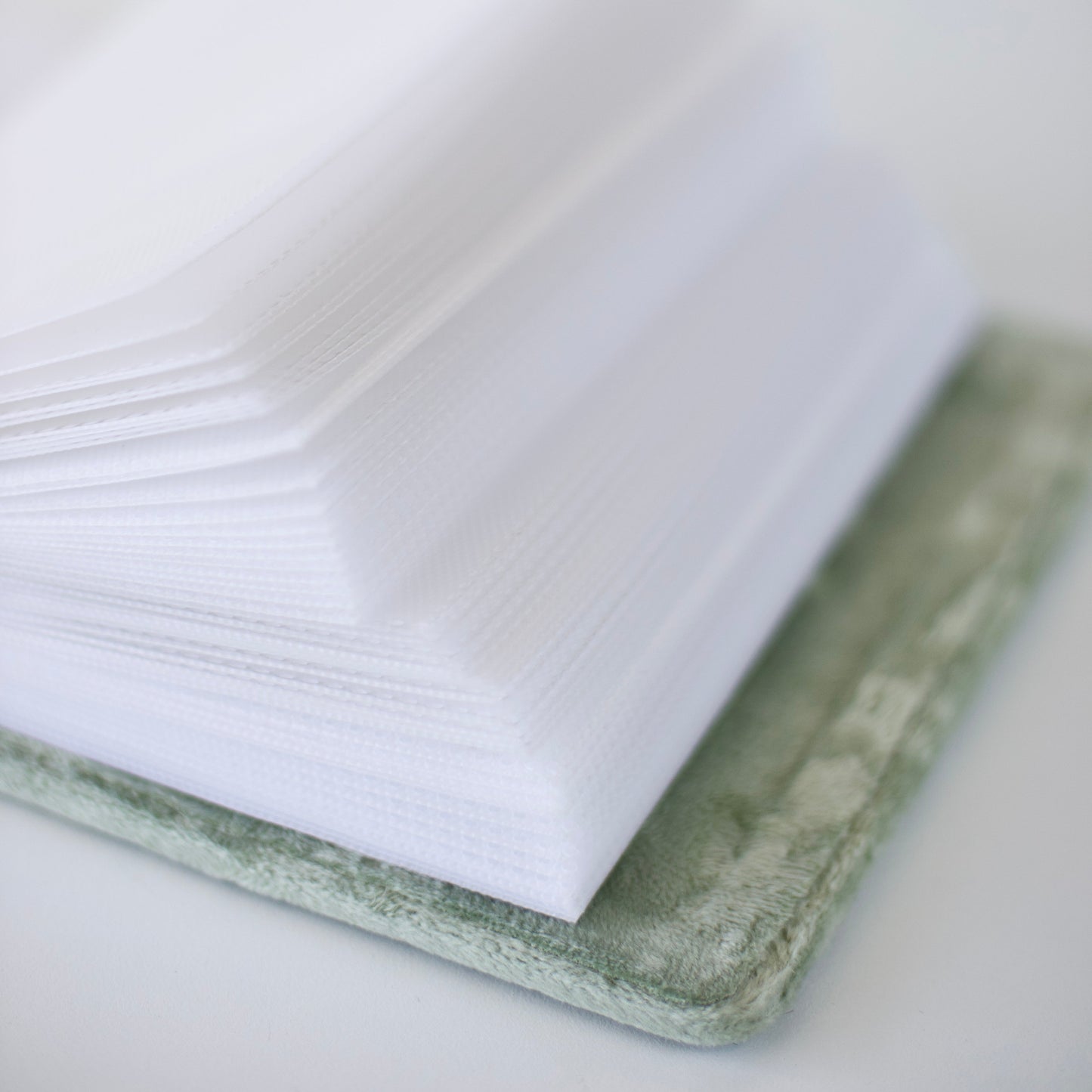 Stack of white papers on a textured surface